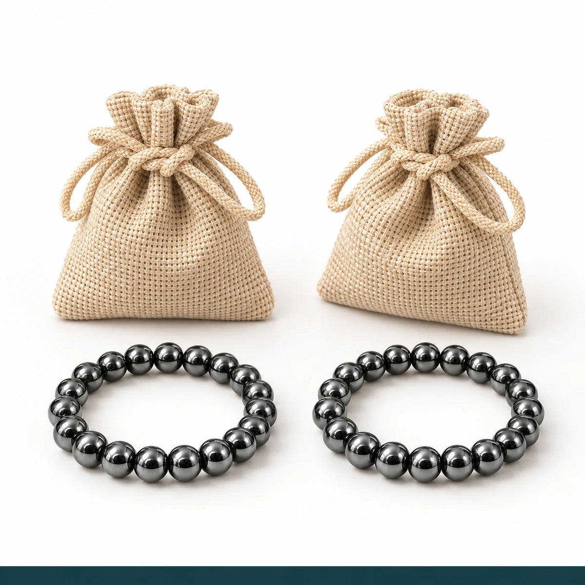 Dos pulseras de hematita y dos bolsas individuales