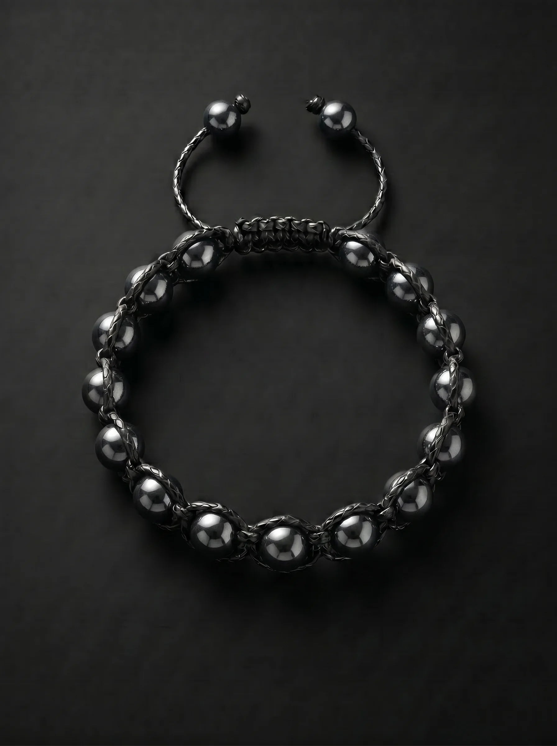 Pulsera PRESENCIA completa de hematita pulida y tejido negro